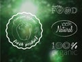 Vector illustration set of organic food logos on a blur forest backdrop