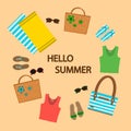 Set of summer things on a sand background, wicker bags, sandals, sunglasses, beach towels.