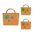 Set of three wicker bags decorated with multicolored flowers. Isolated on white background. For fashionable woman. Beautiful gift. Royalty Free Stock Photo