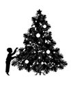 Vector illustration. Silhouette of a child placing toys on Christmas tree