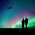 Old lovers and flying aircraft in park at night