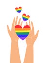 Vector illustration of two hands holding LGBTQ rainbow heart colors. Concept of pride, freedom, equality, rights, lesbian, gay Royalty Free Stock Photo