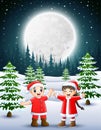Two kids wearing a red santa waving and laughing on a snowy garden