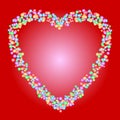 Heart shape pattern of colorful beads on red background. Love, romance, valentine, or wedding concepts. Royalty Free Stock Photo