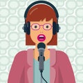 Woman speaking into microphone and wearing headphones Royalty Free Stock Photo