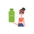 A woman holds a bottle made of biodegradable plastic in her hands. Concept of green world and ecology. Isolated. Trend Royalty Free Stock Photo