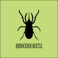 Vector image - black silhouette of rhinoceros beetle on pistachio background.