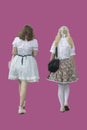 Vector image of two girls dressed in white vintage dresses with pink background, Lolita style.