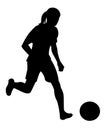 Isolated silhouette of a women's football player in sports uniform running with the ball on the field