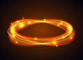 Vector magic gold circle. Glowing fire ring trace on black background. Ellipse line with flying sparkling flash lights. Royalty Free Stock Photo