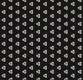 Black and white texture with simple triangular shapes, small elements.