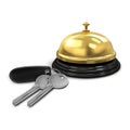 Two silver keys with a black keychain from the hotel room and hotel service bell gold color. Royalty Free Stock Photo