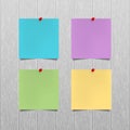 Vector mockup. Sheets of color paper with a red push pins hanging on a gray wooden office wall. Empty blanks, notes. Royalty Free Stock Photo