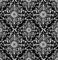 Vector monochrome floral pattern with folk ornament. Seamless tiled texture with white rural contour flower composition on black