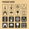 Vector packaging symbols on cardboard background. Icon set including fragile, this side up, handle with care, keep dry and Royalty Free Stock Photo