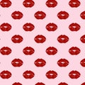 Vector pattern with red lip prints on a pink background. Colored ornament with kisses in the style of pop art. Royalty Free Stock Photo