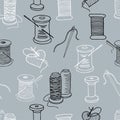Seamless background of spools of threads and needles