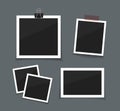 Vector photo frames sticked with tape and hanged on paper clip. Retro fotos. Dark background.