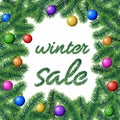 Vector with winter sale sign framed with coniferous tree branches with needle leaves and hanging colorful Christmas bulbs Royalty Free Stock Photo