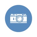 Vector rangefinder camera icon placed on blue