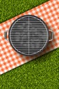 Vector realistic 3d illustration of barbecue grill, red plaid on green grass lawn. Bbq picnic in park.