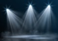 Vector realistic empty illuminated stage with three spotlights and mist on dark blue background Royalty Free Stock Photo