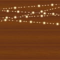 Vector realistic lantern garland on wood background with snowflakes