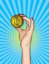 Vector retro illustration pop art comic style of a woman`s hand holding a golden coin.