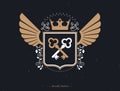 Vector retro insignia design decorated with eagle wings and made using vintage elements like royal crown . Royalty Free Stock Photo