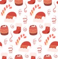 Vector seamless Christmas pattern. Xmas background with red hand drawn new year hats, treats and sock on white background Royalty Free Stock Photo