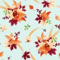 Seamless pattern with colorful autumn leaves on a pale turquoise background. Vector illustration. Royalty Free Stock Photo