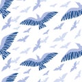 Vector seamless pattern consisting of flying birds of different sizes on a white background.