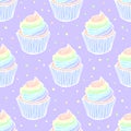 Vector seamless pattern with cupcakes with rainbow cream.