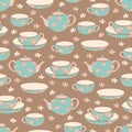 Vector seamless pattern with cups, saucers, teapots and flowers.