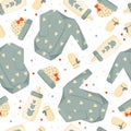 Cute green baby clothes background. Vector seamless pattern