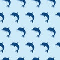 Vector seamless pattern with cute jumping dolphins on blue background Royalty Free Stock Photo