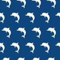 Vector seamless pattern with cute jumping dolphins white on blue background Royalty Free Stock Photo