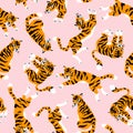 Vector seamless pattern with cute tigers on the pink background. Circus animal show. Fabric design.