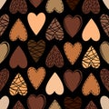 Vector seamless pattern with decorated hearts of colors of chocolate on black