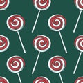 Vector seamless pattern with hand drawn christmas candies on dark green background Royalty Free Stock Photo