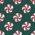 Vector seamless pattern with hand drawn christmas candies on dark green background Royalty Free Stock Photo