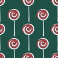 Vector seamless pattern with hand drawn christmas candies on dark green background Royalty Free Stock Photo