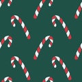 Vector seamless pattern with hand drawn christmas candies on dark green background Royalty Free Stock Photo