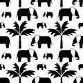 Vector Seamless pattern with hand drawn silhouette elephants and baby elephant, palm trees Royalty Free Stock Photo