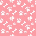 Vector seamless pattern with hand drawn white bones and dog paws on a pink background Royalty Free Stock Photo