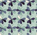 Vector seamless pattern with hearts placed in clover shapes. Flat shamrock imagined colors background. Simple repeating