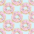 Vector seamless pattern illustration of donuts in pink glaze on a blue Royalty Free Stock Photo