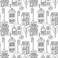 Vector seamless pattern with the image of vintage monochrome houses, street lamps and plants. Design for printing postcards,