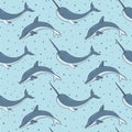 Vector seamless pattern with narwhals and dolphins on the blue