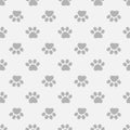 Vector seamless pattern with paws footprints.